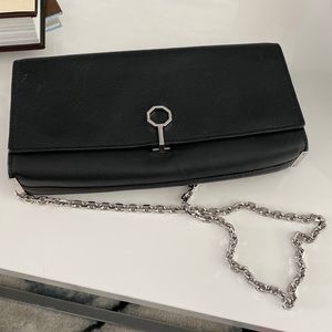 Black leather Authentic Louis ct Cie clutch purse